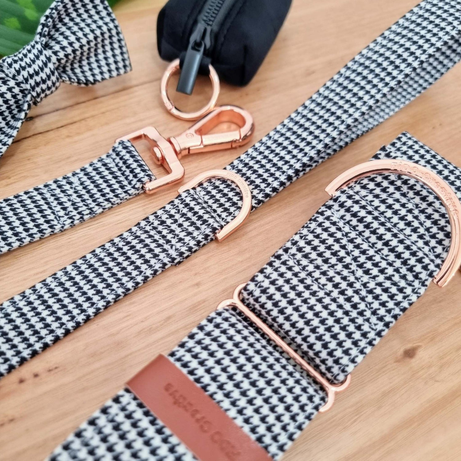 a black and white checkered martingale collar with a rose gold