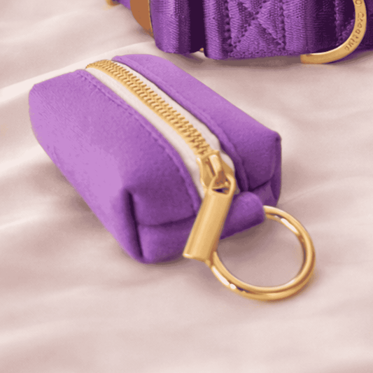 purple dog poop bag holder with gold zip