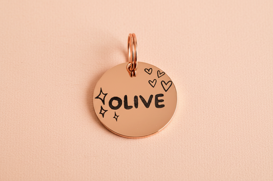 Rose Gold dog tag with 'OLIVE' engraved