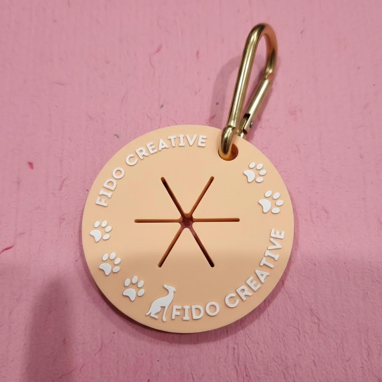 Round used dog waste bag holder with 'Fido Creative' branding